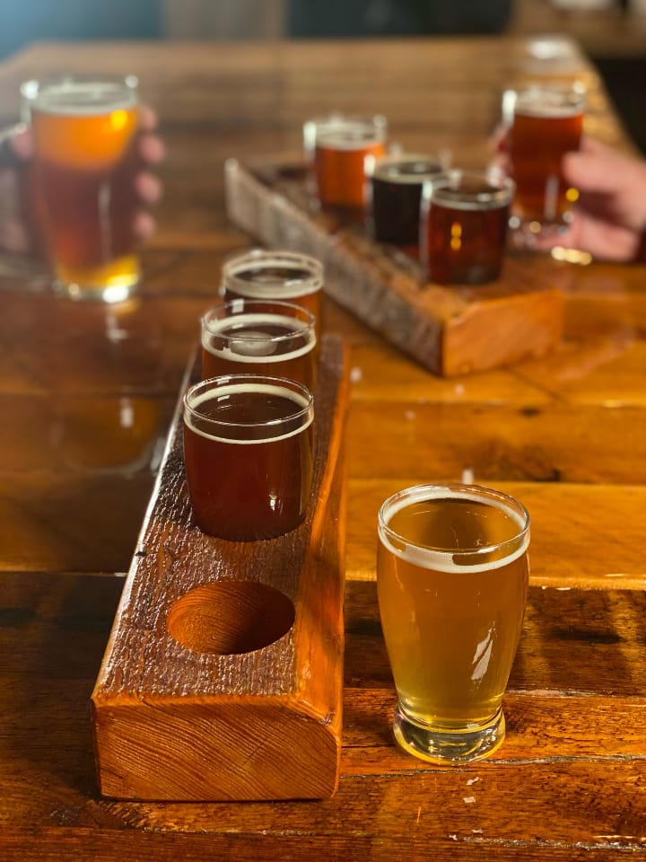 Two flight of beers on a table at Harbor Light Brewery.