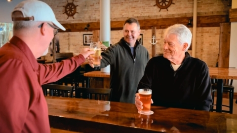 Serving a beer at Harbor Light Brewery.